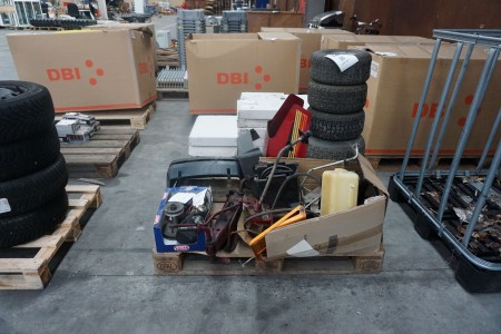 Various spare parts and tires for garden tractors