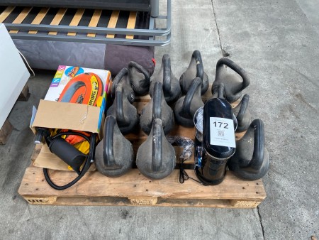 Various kettlebells, stirrer and inflatable boat