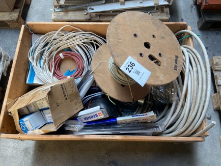 Pallet with various cables, wires, screws, etc.