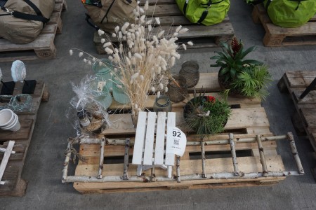 Contents on pallet of various flowers, trinkets, etc
