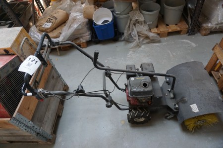 Tool carrier with broom