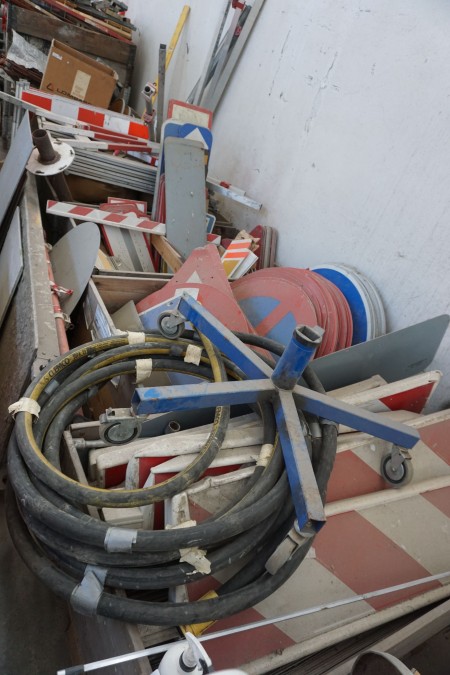 Pallet with various hoses, road signs, etc.