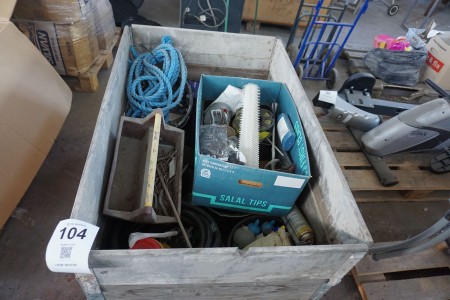Pallet with various measuring tapes, hoses, screws, etc.