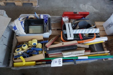 Pallet with various broom handles, paint rollers, screws, etc.