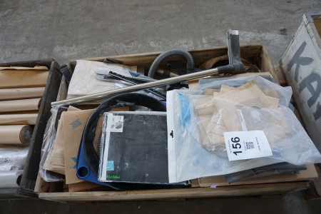 Pallet with various vacuum cleaner hoses, bags etc.