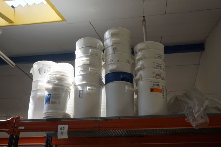 Lot of paint buckets on top of pallet rack