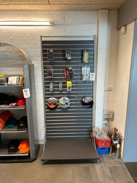 Bookcase containing various fishing equipment