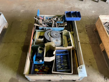 Pallet with various screwdrivers, cutting discs, welding pliers, etc.