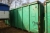 Waste Container, green, approx. 20 feet. Manual hoist of the top. Hook lift