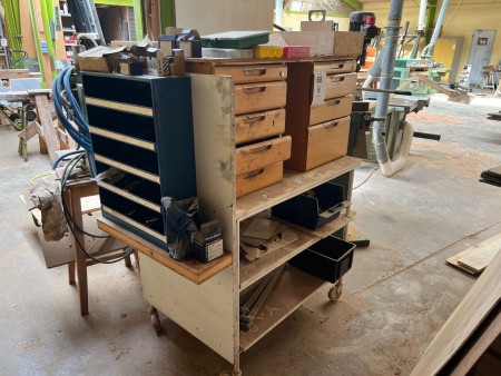 Workshop rolling table with various assortment shelves with contents
