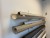Various rolls of textile for roller blinds on the wall