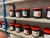 Contents of 6-bay workshop shelf of textile paint, etc.