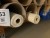 8 tubes containing various textiles & types of fabric