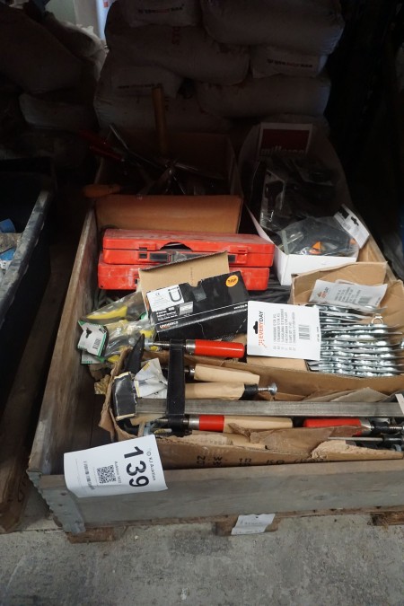 Pallet with various screw clamps, glue guns, etc.