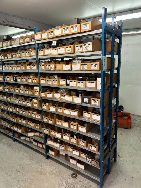 4-bay workshop shelf containing a large batch of spare parts