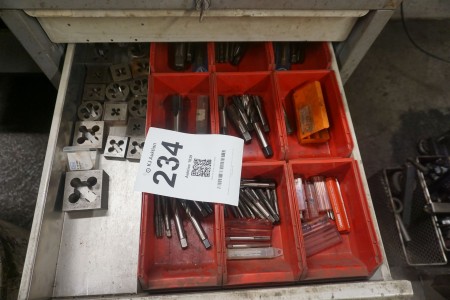 2 shelves with various threading tools