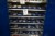 Contents of 7 shelves of various bolts, bulbs, mortar, etc.