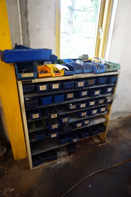 Assortment rack containing various bolts, nuts, washers, etc.