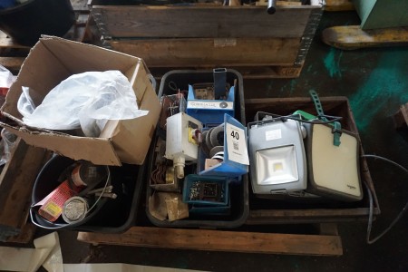Pallet with various work lamps, spare parts, etc.