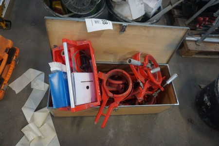Wooden toolbox with contents of various construction articles