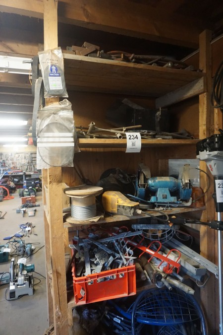 Contents on shelf of various brackets, bench grinder, steel wire, etc.