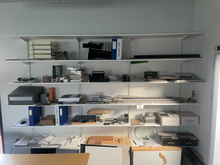 6 shelves containing various exhibition accessories