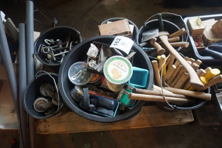 Pallet with various ax handles, spare parts, etc.