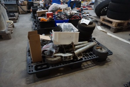 Pallet with various spare parts for trailers, grease guns, etc.