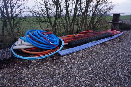 Lot of plastic drainage hoses, etc.