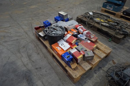 Pallet with various screws, nails, etc.