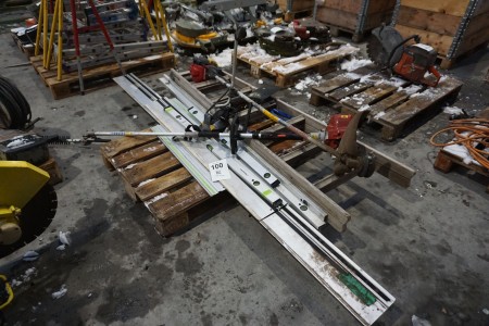 Pallet with various spirit level, rails and brush cutter
