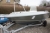 Used dinghy with steering console. DLRG Norgaardholz, SilverHawk kFIN61-01-0162. LxBxKg: 5,20 x 2,07 m x 395 kg. Newly varnished. New fender. Trolley