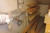 Various oars on wall and floor + shop rack with conten of various engine parts and more