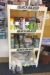 Shop rack with content of various consumables. Sikkens boat paint + polish + wax + diesel detergents and more