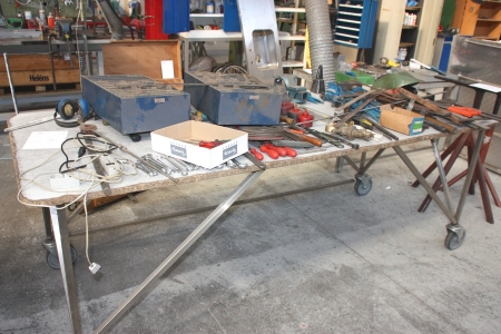 Work table on wheels with content including hand tools, 2 range racks, Vices, clamps, grinding / cutting discs, pliers, etc.