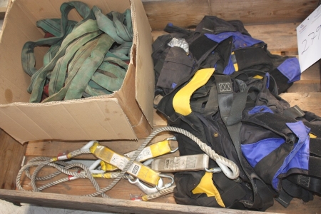 Pallet with various lifting straps and harness