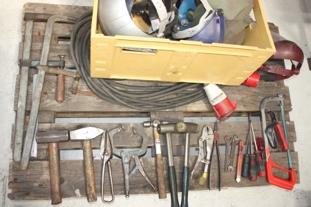 Pallet with hand tools + welding helmet + power cable + clamp