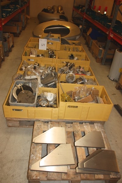 Various components in plastic crates and pallets