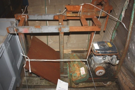 Welding surface with vice and plate compactor (condition unknown)