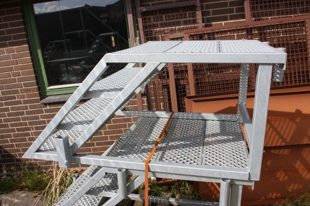 Galvanized stair landing. Unused. 3 steps. Landing height approx. 540mm. Can be fitted with transport wheels (which may be purchased separately from the seller)