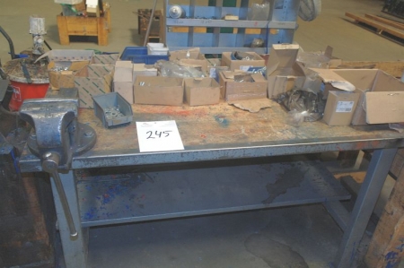 Work bench with vise containing various assortment boxes with screws + bolts + nuts etc.
