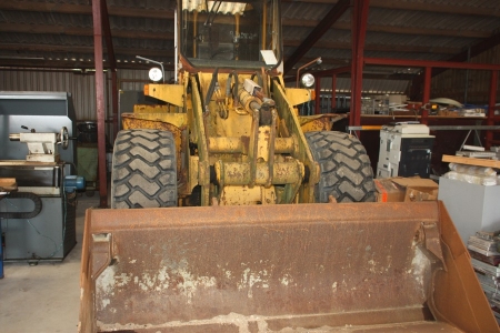 Wheel loader. Hanomag 33D, SN: 373,321,874. Hours: 10871. Combination Bucket, length approx. 2450 mm. Opening approx. 1100 mm. Good tread pattern