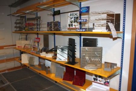 Four sections wall-mounted shelves with various exhibition equipment
