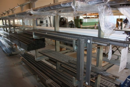 Content of two sections cantilever rack, various iron, pipes, wires etc.