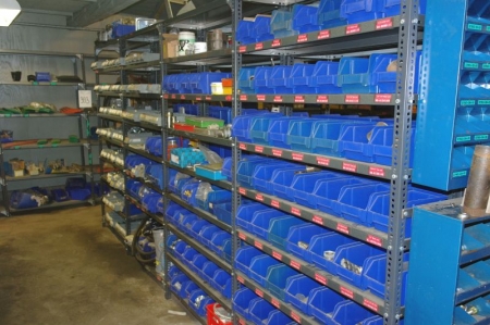 8 span steel rack containing various hydraulic fittings + fuses + batteries + filters + infrared lamps etc.