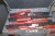 Würth Assortment boxes on the wall containing various cutting tools + drill, etc. on wall
