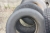 4 truck tires on rims, different brands, 305/70 R22.5 + 2. tire 315/70 R22.5. Used