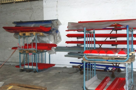 Various racks with parts for seeding machine, etc.