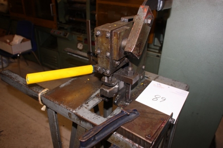 Punches and cutting tool on pedestal