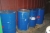 Container 20 feet containing various barrels with paint + barrels of waste oil